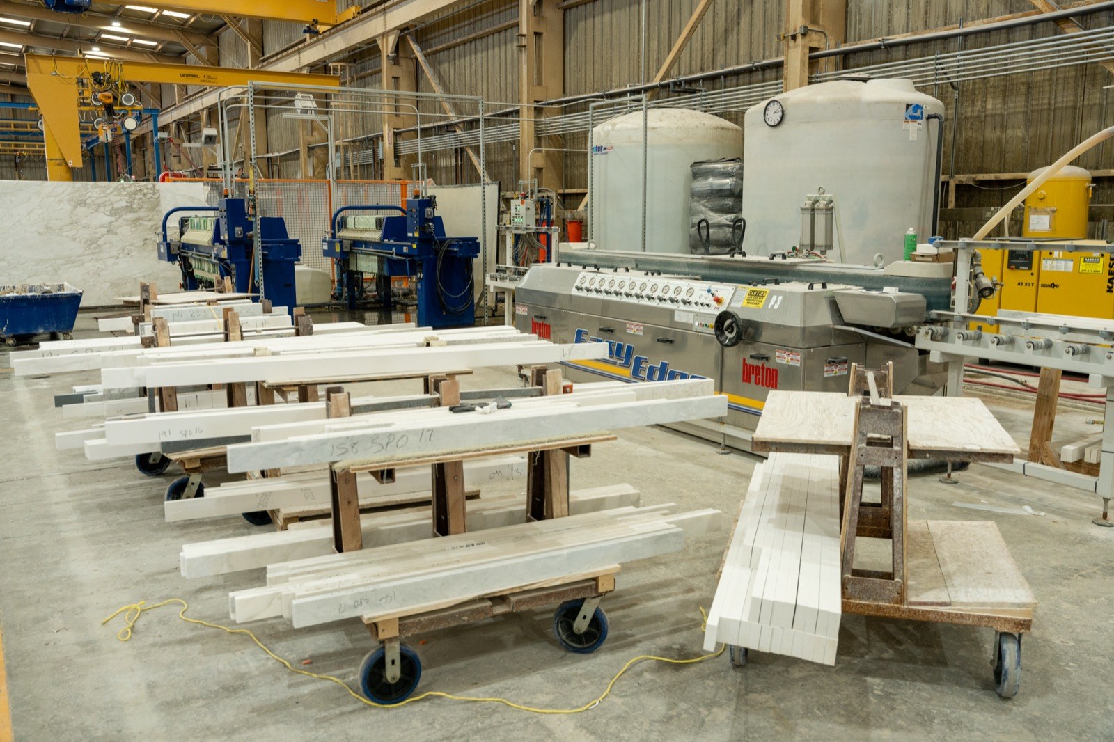 Fox fabrication floor with stonework equipment and material pieces.